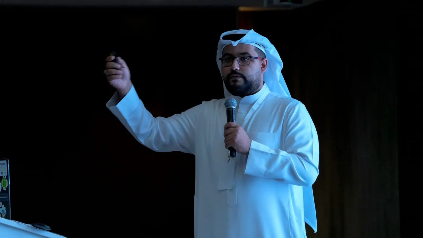 Sayed Ali Alkamel presenting in Gulf national dress at an event in Oman